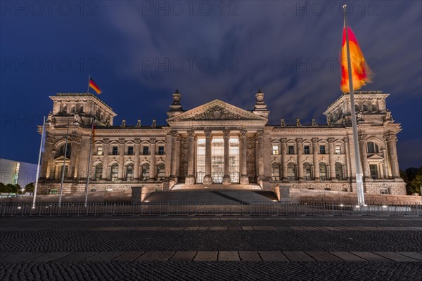 Reichstag with waving German flag