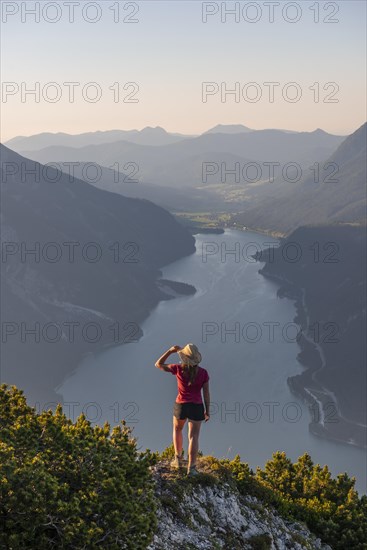 Young woman looking over mountain landscape