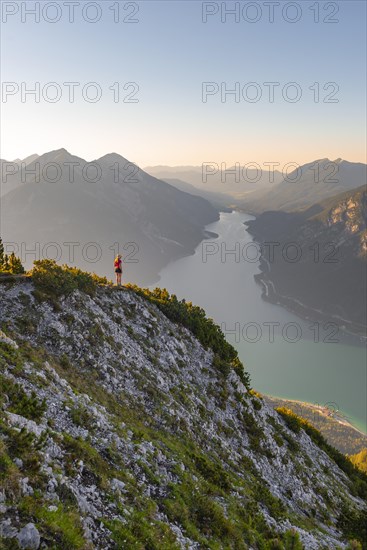 Young woman looking over mountain landscape