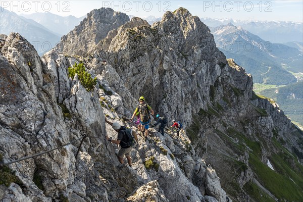 Mountaineer on a secured fixed rope route