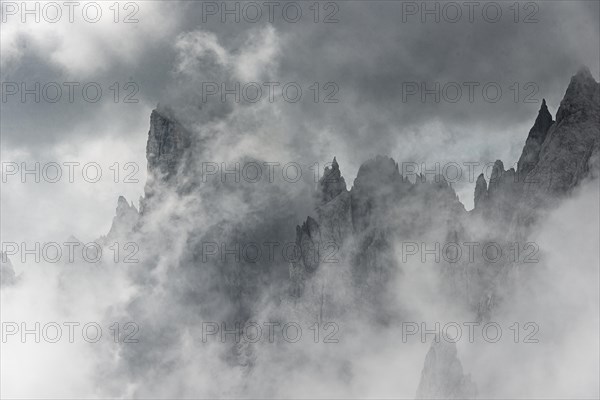 Bizarre mountain peaks with dramatic clouds