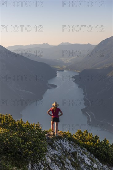 Young woman looking over mountain landscape