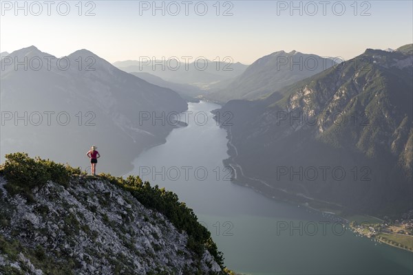 Young woman looking over mountain landscape