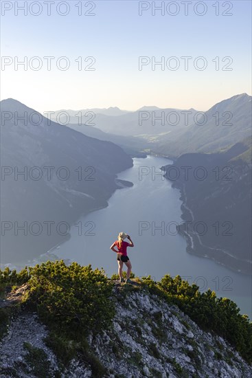 Young woman looking over mountain landscape