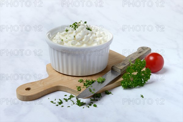 Cream cheese with parsley in bowl