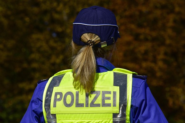 Policewoman with lettering Police