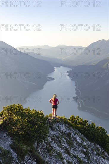 Young woman looking over mountain landscape