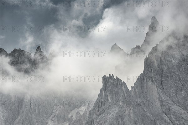 Bizarre mountain peaks with dramatic clouds