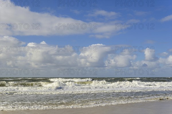 Running out waves on the sandy beach