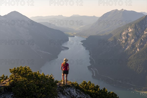 Young woman looking over mountain landscape