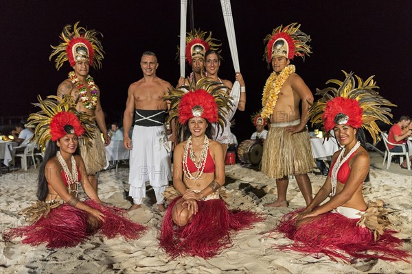 Native dance group poses in front of camera