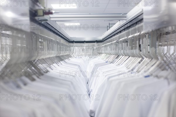 Doctor's coats after cleaning hang in the wardrobe at the hospital