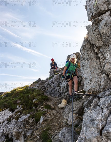 Mountaineers on a secured fixed rope route