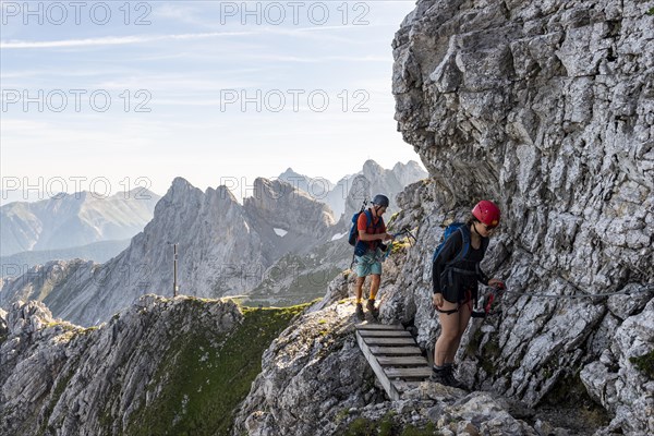 Mountaineer on a secured fixed rope route