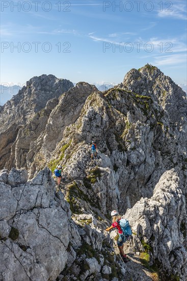 Mountaineer on a secured fixed rope route