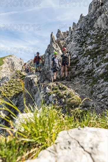 Mountaineer on a secured fixed rope route