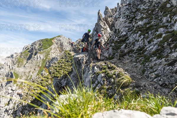 Mountaineer on a secured fixed rope route