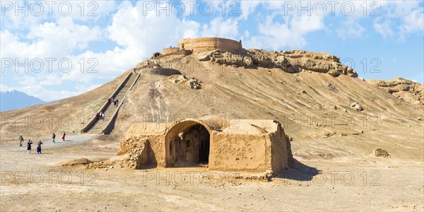 Ruins of ritual buildings in front of Dakhmeh Zoroastrian Tower of Silence