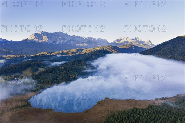 Wafts of fog over Lake Barmsee near Kruen