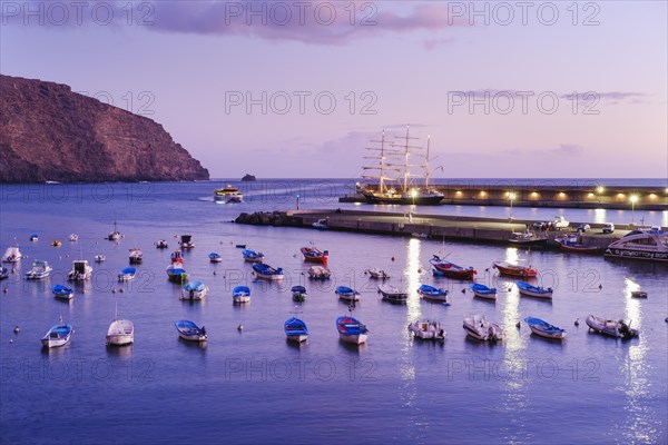 Fishing boats in the fishing port at dusk