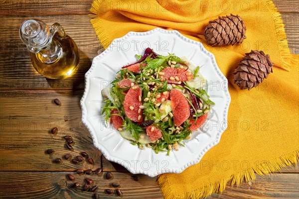 Served salad on a plate with grapefruit