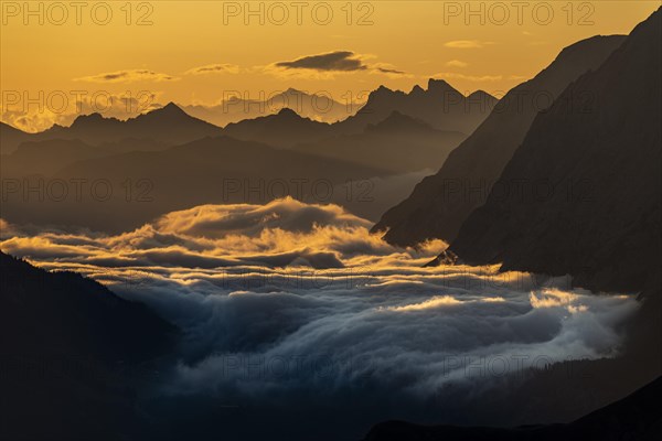 Sunrise over Lechtal Alps with fog in the valley