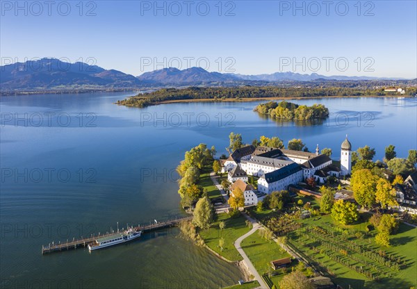 Steam jetty and Benedictine monastery Frauenwoerth on Fraueninsel