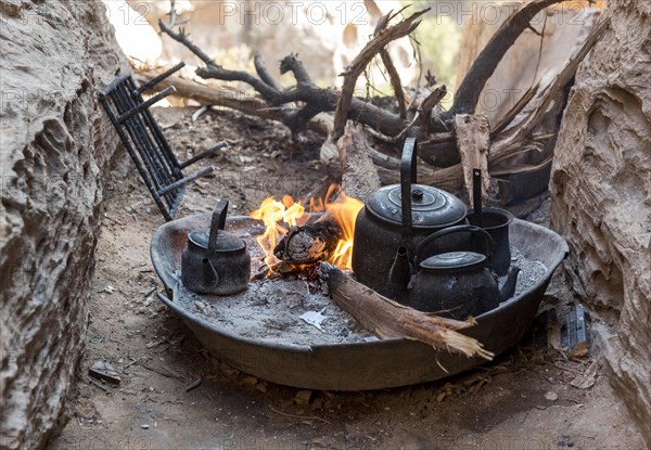 Traditional preparation of tea on wooden fire