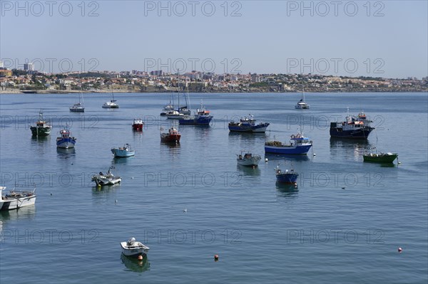 Fishing boats anchor off the coast