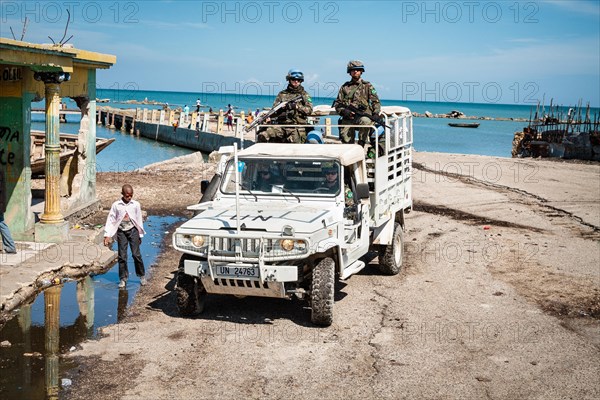 UN blue helmets in jeep on patrol