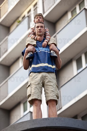 Sculpture Column saints father and son on an advertising pillar