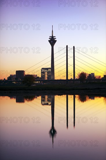 Silhouette at sunset with city gate