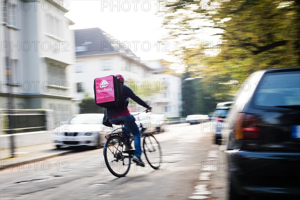 Delivery of food by a courier driver on a bicycle