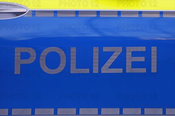 Police vehicle with police lettering on the side door