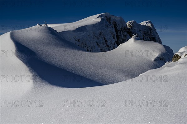 Summit of the Toreck with snow cornices and blue sky