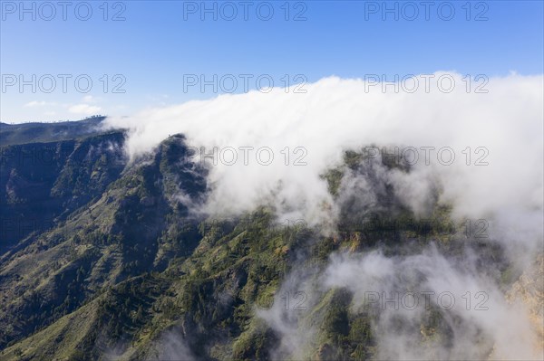 Trade wind clouds over the mountain ridge