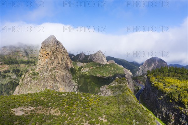 Volcanic rock towers Roque de Agando with Roque de Zarcita and Roque de Ojila and high road