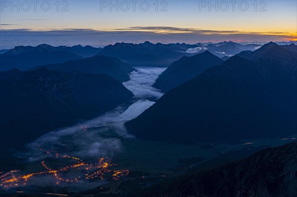 Sunrise over Lechtal Alps with fog in the valley