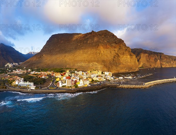 Vueltas with fishing harbour and mountain Tequergenche in the evening light