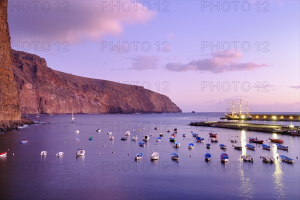 Fishing boats in the fishing port at dusk