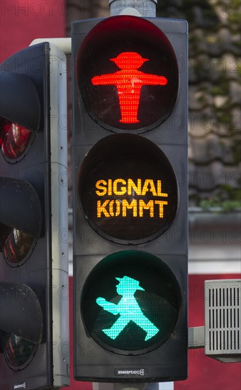 Red and green traffic light male of a pedestrian traffic light