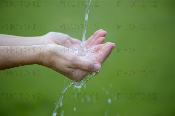 Water jet flows into hands