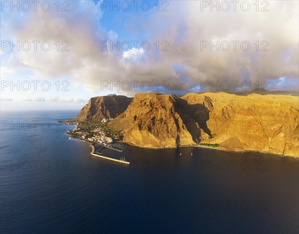 Vueltas with fishing harbour and Argaga gorge in the evening light