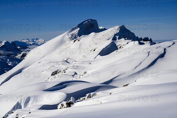 Summit of the Toreck with snow cornices and blue sky