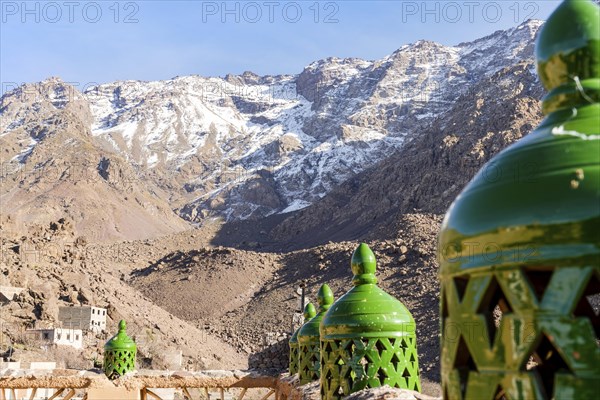Moroccan green lanterns with Toubkal mountain range