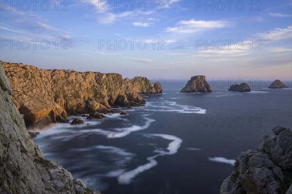 Rocky coast in the evening light at Pointe de Penhir