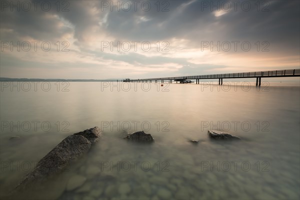 Longest jetty at Lake Constance in the morning light in Altnau