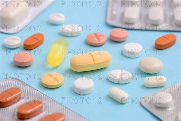 Various pills om blue background