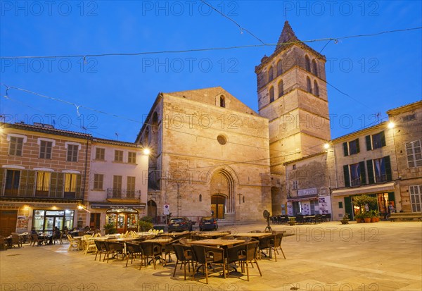 Parish church Nuestra Senyora de los Angeles and main square at dusk