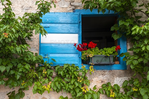 Blue and white shutter of a mountain hut